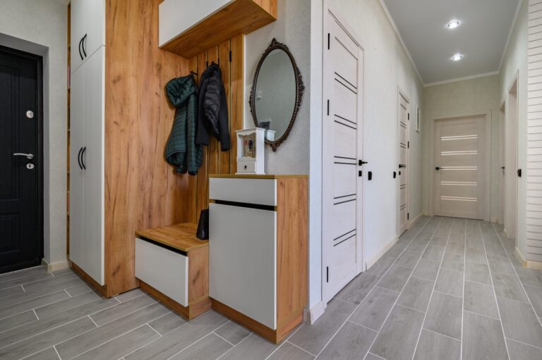 small-entrance-hallway-interior-with-shoe-storage-hanger-stand-mirror-scaled